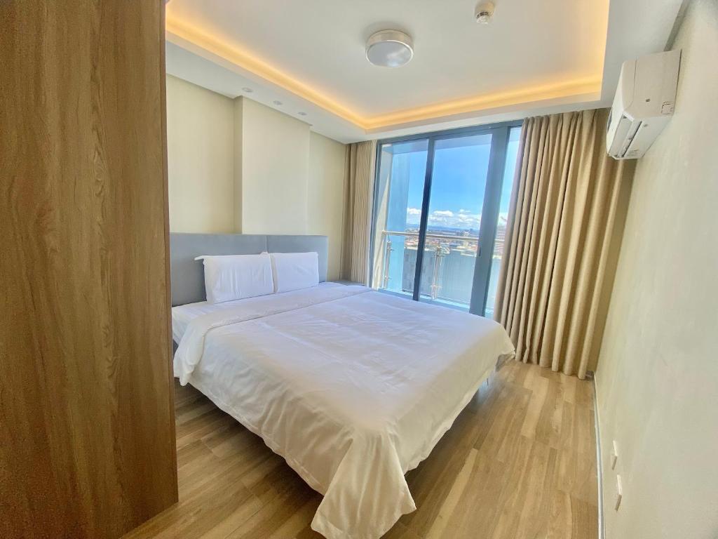 Voodi või voodid majutusasutuse City Center Executive Hotel-Near Manila Airport and PITX toas