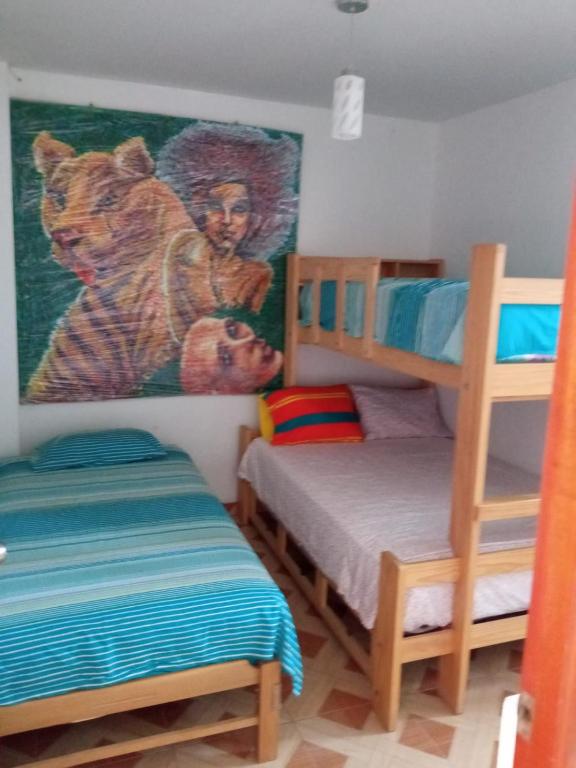 Postel nebo postele na pokoji v ubytování Hospedaje Los Lobos