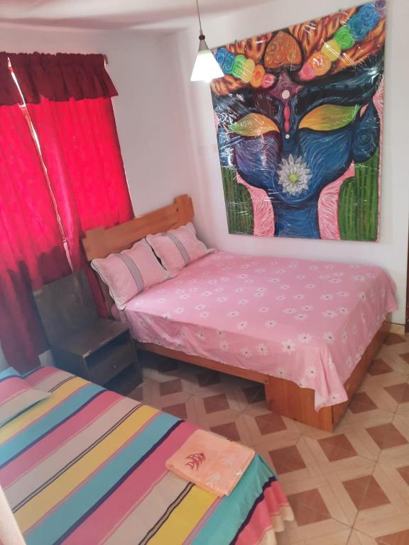 Postel nebo postele na pokoji v ubytování Hospedaje Los Lobos