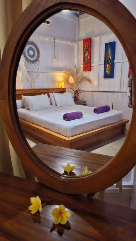 Postel nebo postele na pokoji v ubytování Lotus & Teak Villas