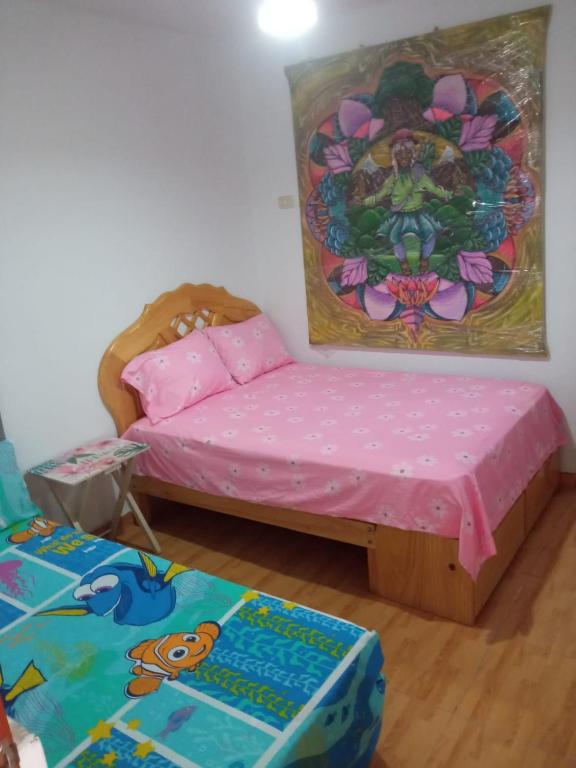 Postel nebo postele na pokoji v ubytování Hospedaje Los Lobos