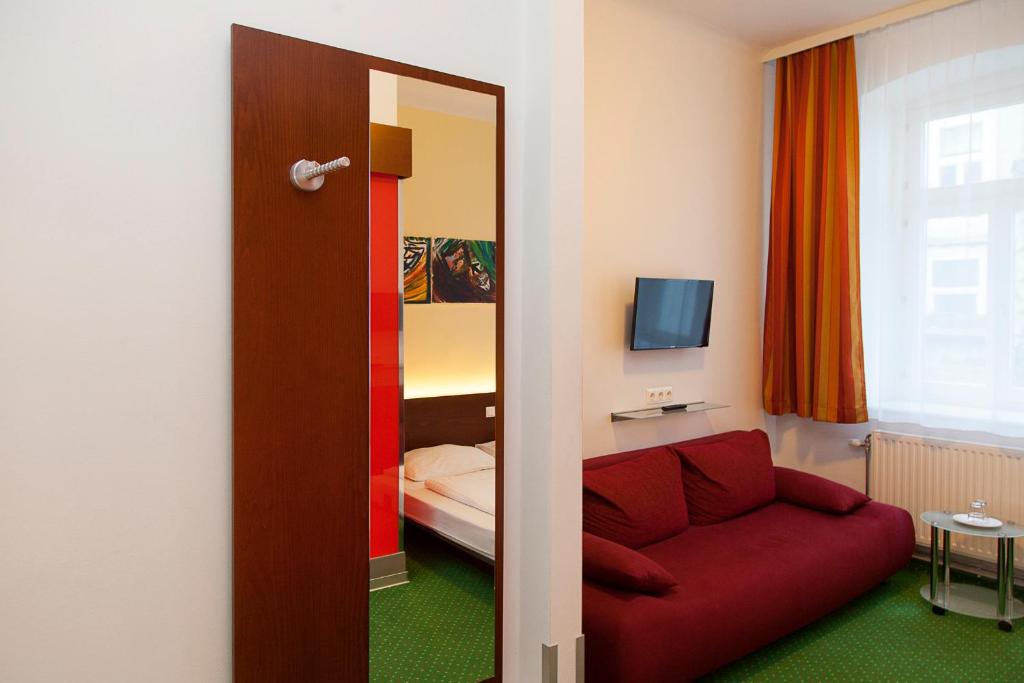 Postel nebo postele na pokoji v ubytování Pension Stadthalle