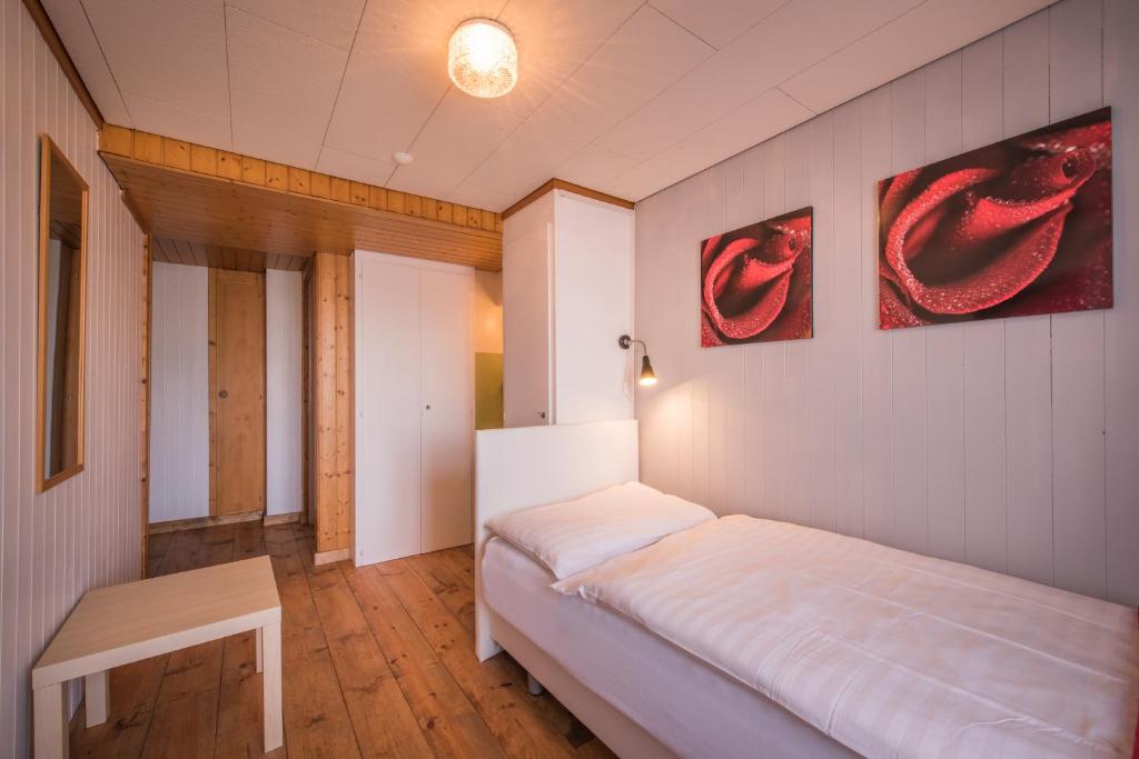 Letto o letti in una camera di Hotel Tell and Apartments