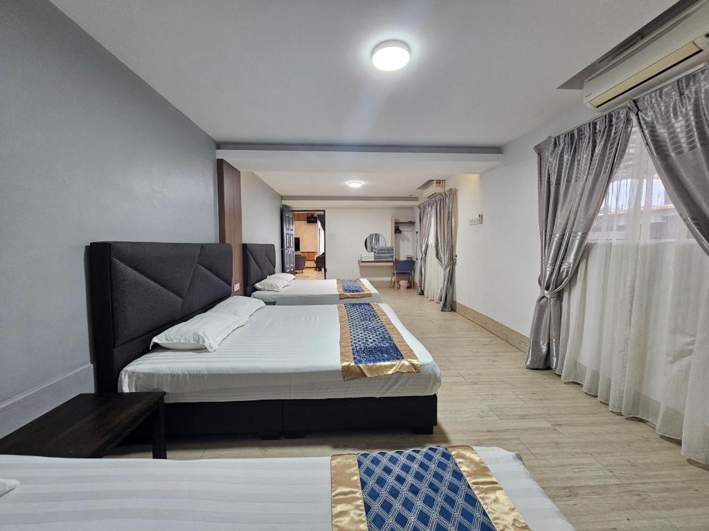 Postel nebo postele na pokoji v ubytování Melody Whole Or Suite Room