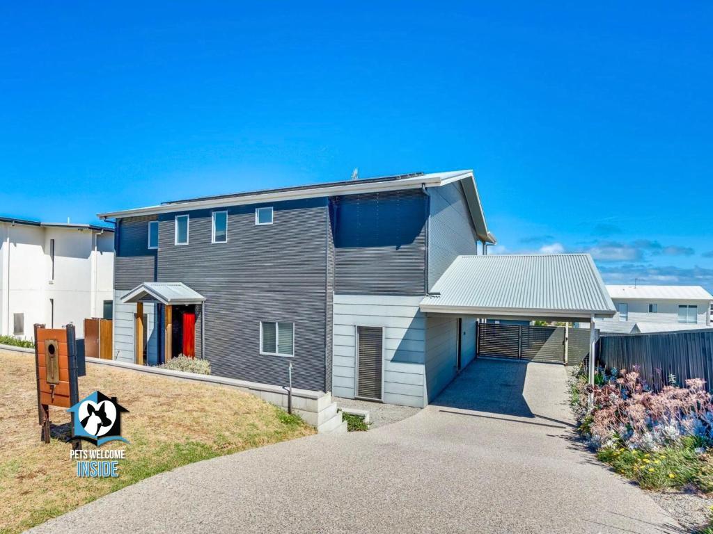 a house with a garage in front of it at Ultimate in Middleton Coastal Style with Views Sleeps 10 in Middleton