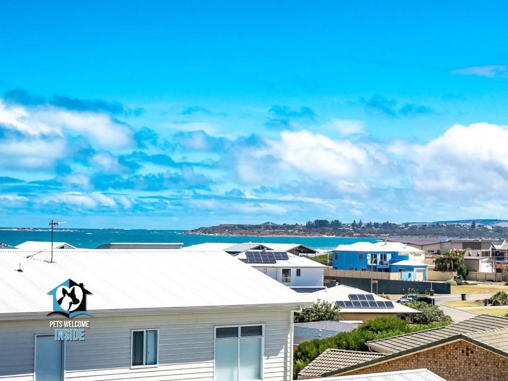a white building with a star on the roof at Ultimate in Middleton Coastal Style with Views Sleeps 10 in Middleton
