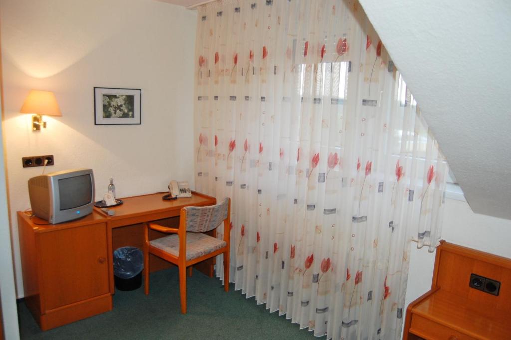TV a/nebo společenská místnost v ubytování Hotel Hubertushof