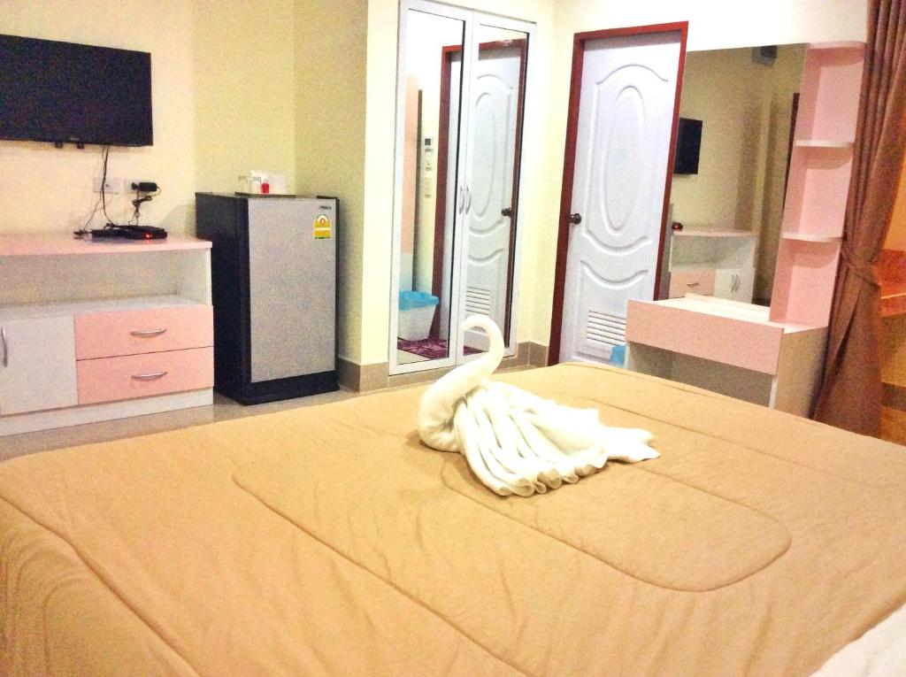 Postel nebo postele na pokoji v ubytování Smile Residence