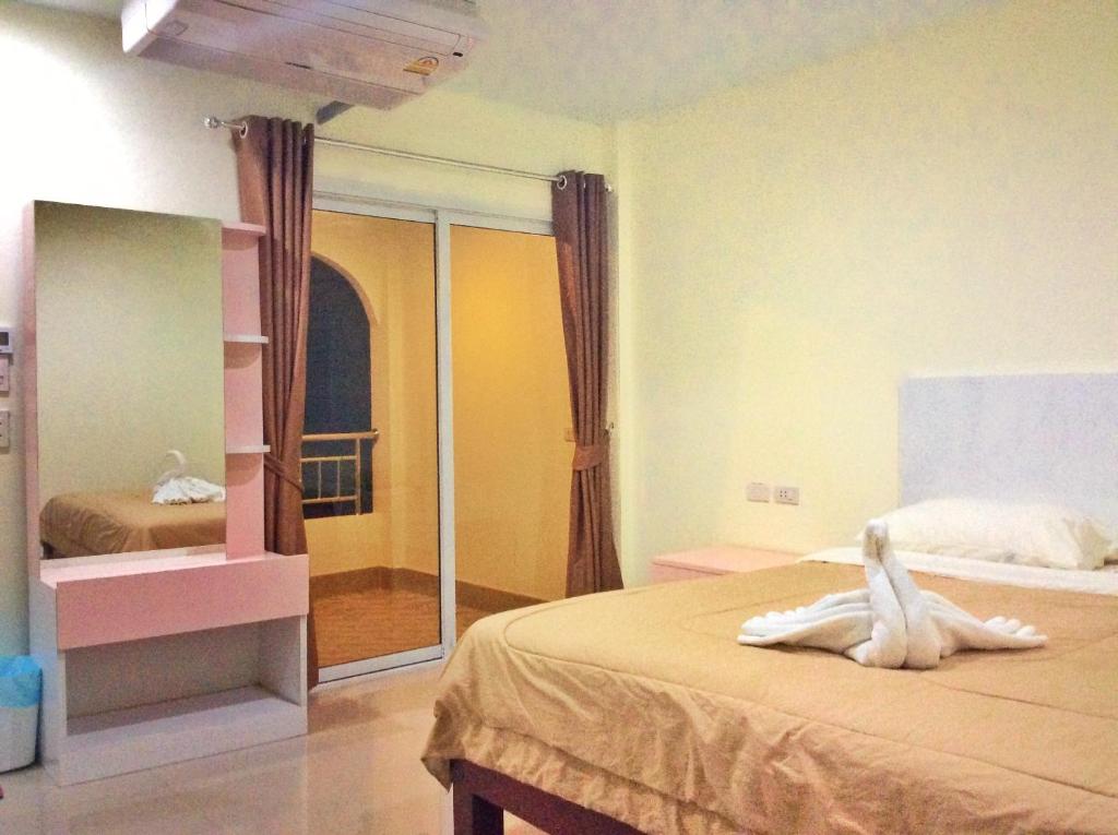 Postel nebo postele na pokoji v ubytování Smile Residence
