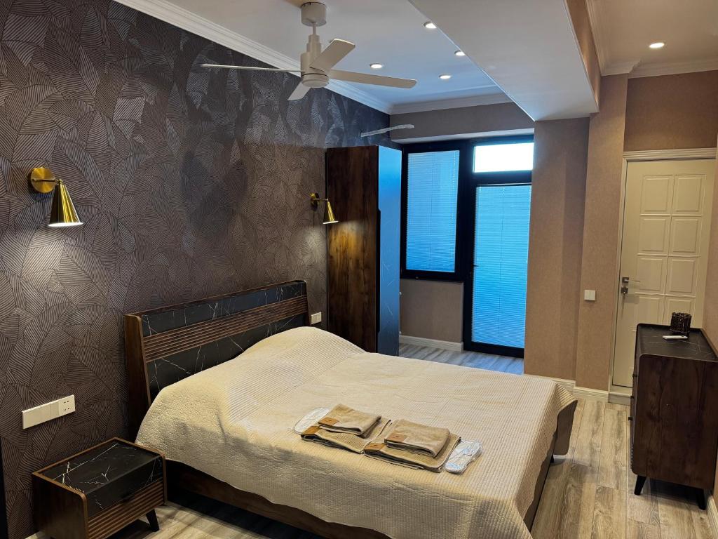 Postel nebo postele na pokoji v ubytování Premium Khatai Residence Boulevard, Victory Park