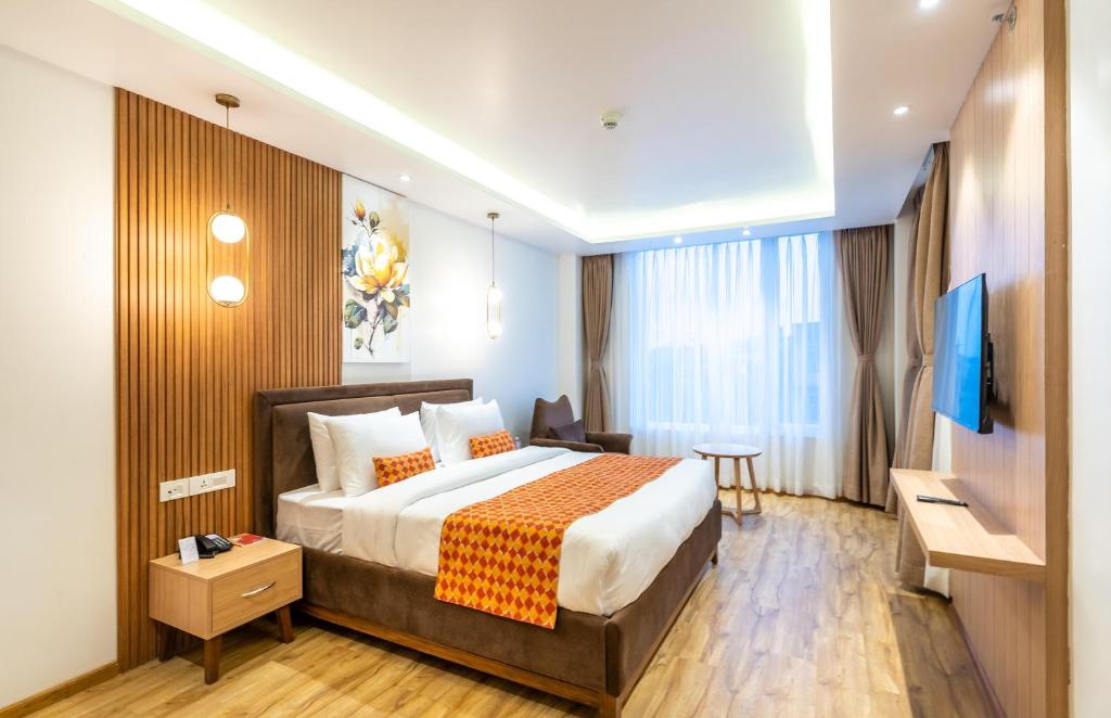 Voodi või voodid majutusasutuse Hotel Anuttara toas