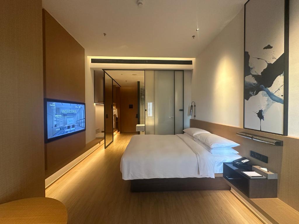 Postel nebo postele na pokoji v ubytování Fairfield by Marriott Quanzhou Fengze