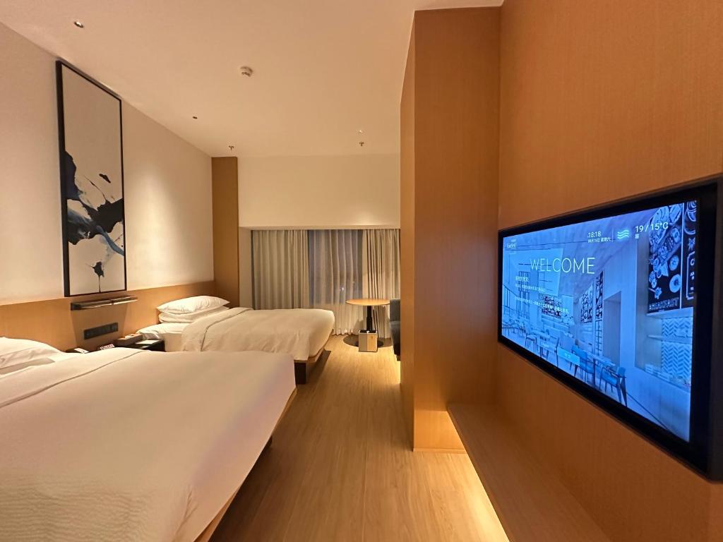 TV a/nebo společenská místnost v ubytování Fairfield by Marriott Quanzhou Fengze