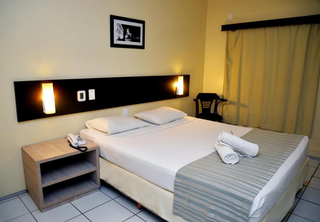 Postel nebo postele na pokoji v ubytování Hotel Premier