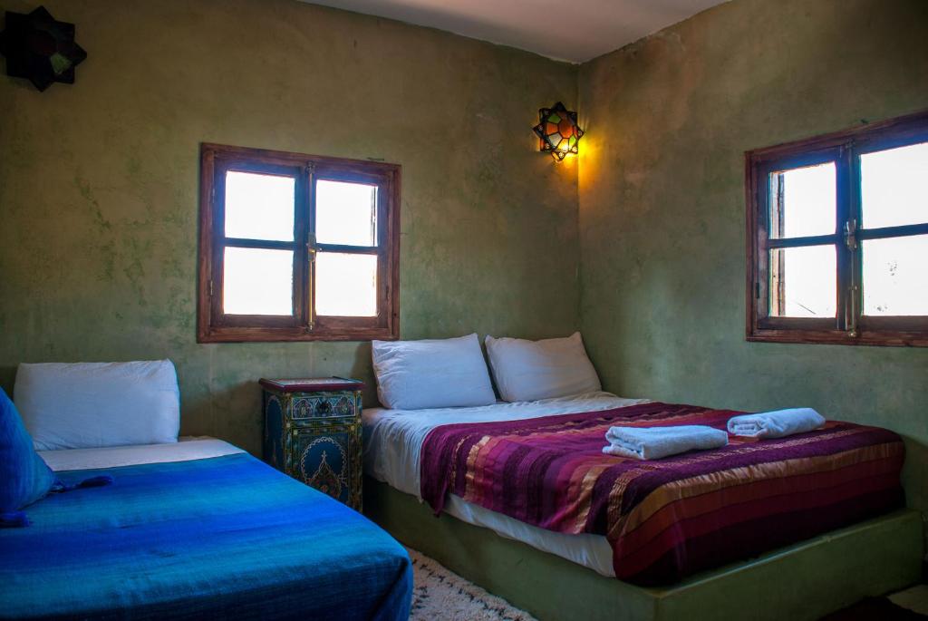 Postel nebo postele na pokoji v ubytování Hôtel Chellal ďOuzoud