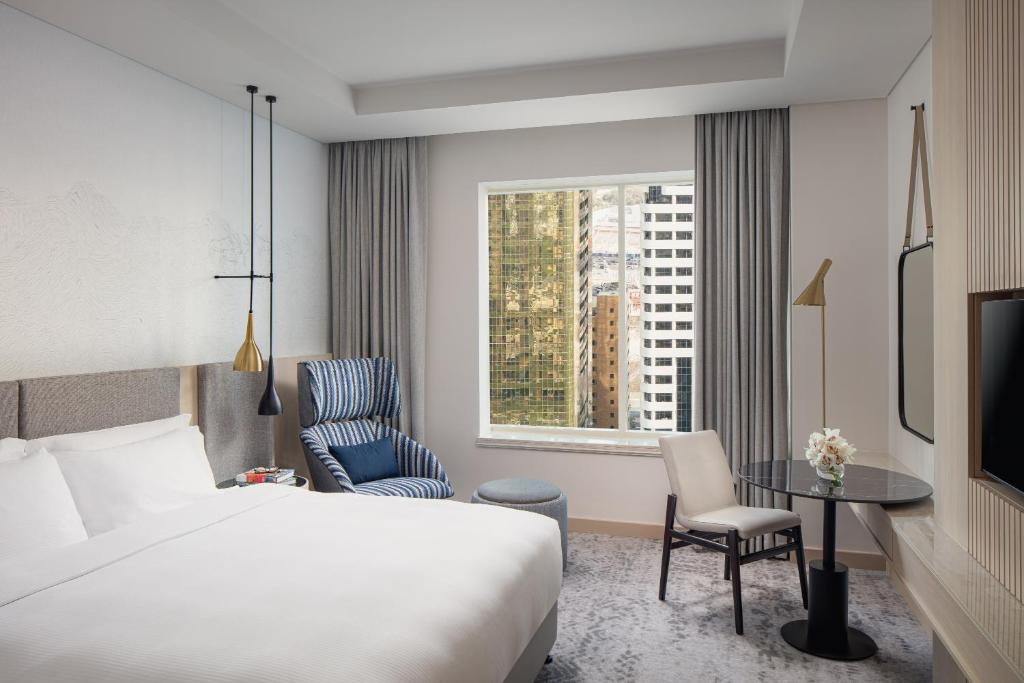 Postel nebo postele na pokoji v ubytování Towers Rotana - Dubai