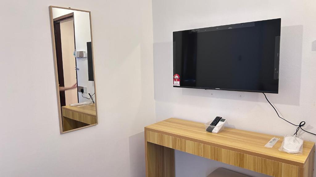 TV a/nebo společenská místnost v ubytování NEW Xing Yue Hotel 星悦自助酒店