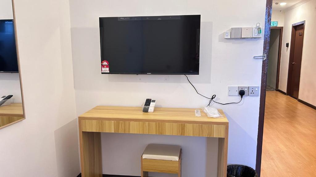 TV a/nebo společenská místnost v ubytování NEW Xing Yue Hotel 星悦自助酒店