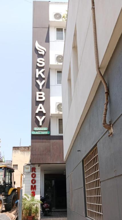 a building with a sign on the side of it at FabHotel Sky Bay Residency in Chennai