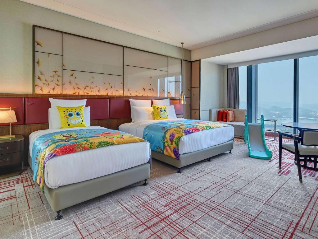 Postel nebo postele na pokoji v ubytování Pullman Huizhou Kaisa