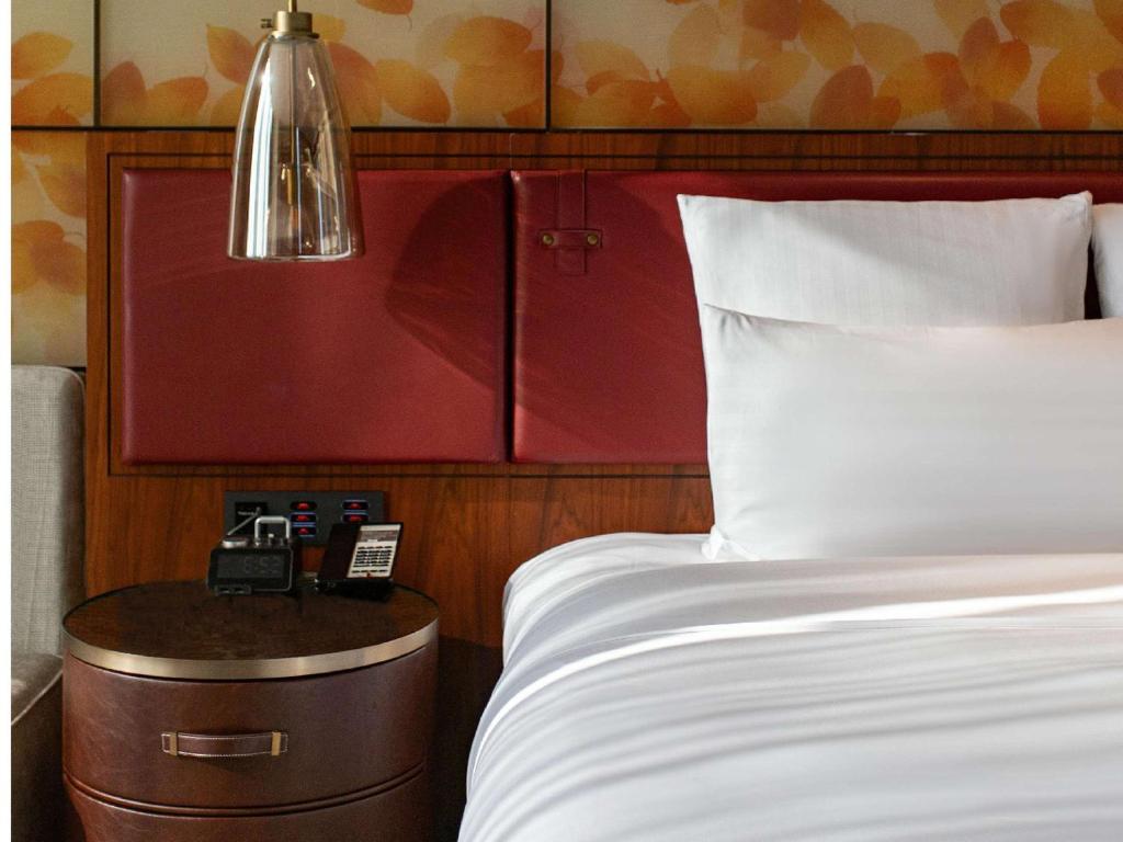 Postel nebo postele na pokoji v ubytování Pullman Huizhou Kaisa