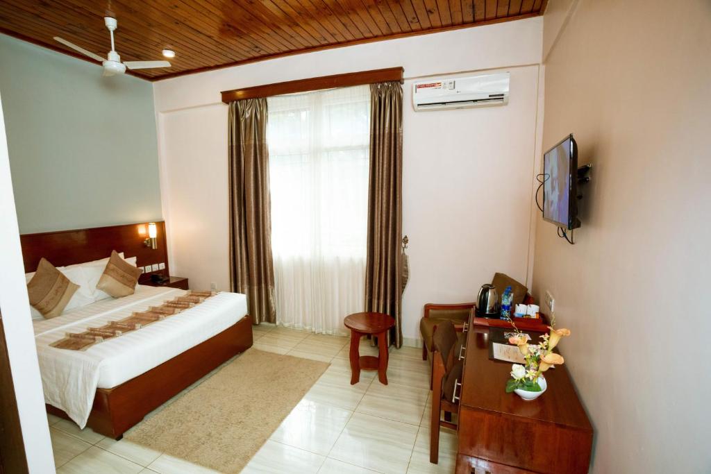 Postel nebo postele na pokoji v ubytování Keys Hotel