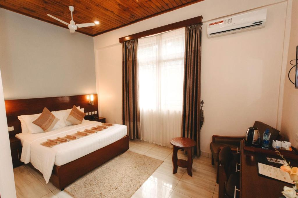 Postel nebo postele na pokoji v ubytování Keys Hotel