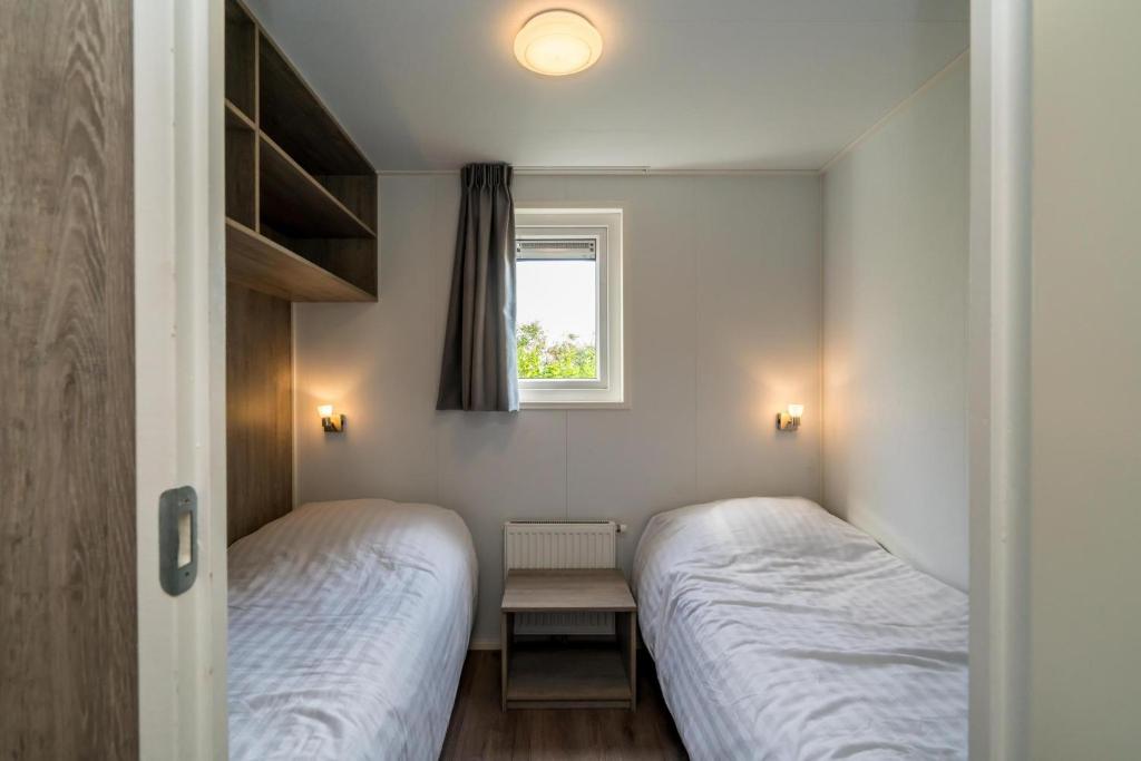 Postel nebo postele na pokoji v ubytování Camping Ginsterveld