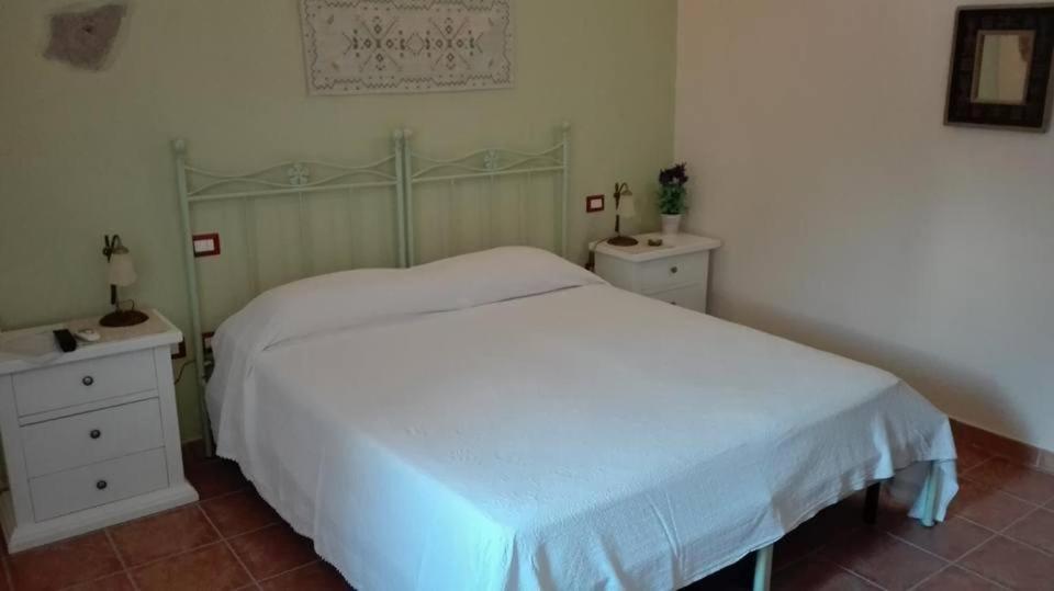 Postel nebo postele na pokoji v ubytování B&B Domu Delunas