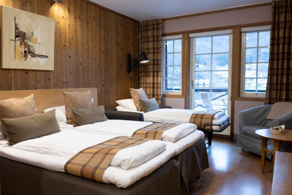 Postel nebo postele na pokoji v ubytování Flåmsbrygga Hotel