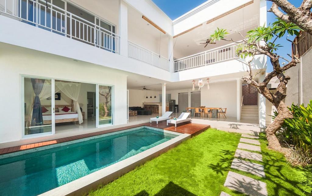 an image of a house with a swimming pool at 3BR Villa3 Oberoi Seminyak,18Min walk to the beach in Seminyak
