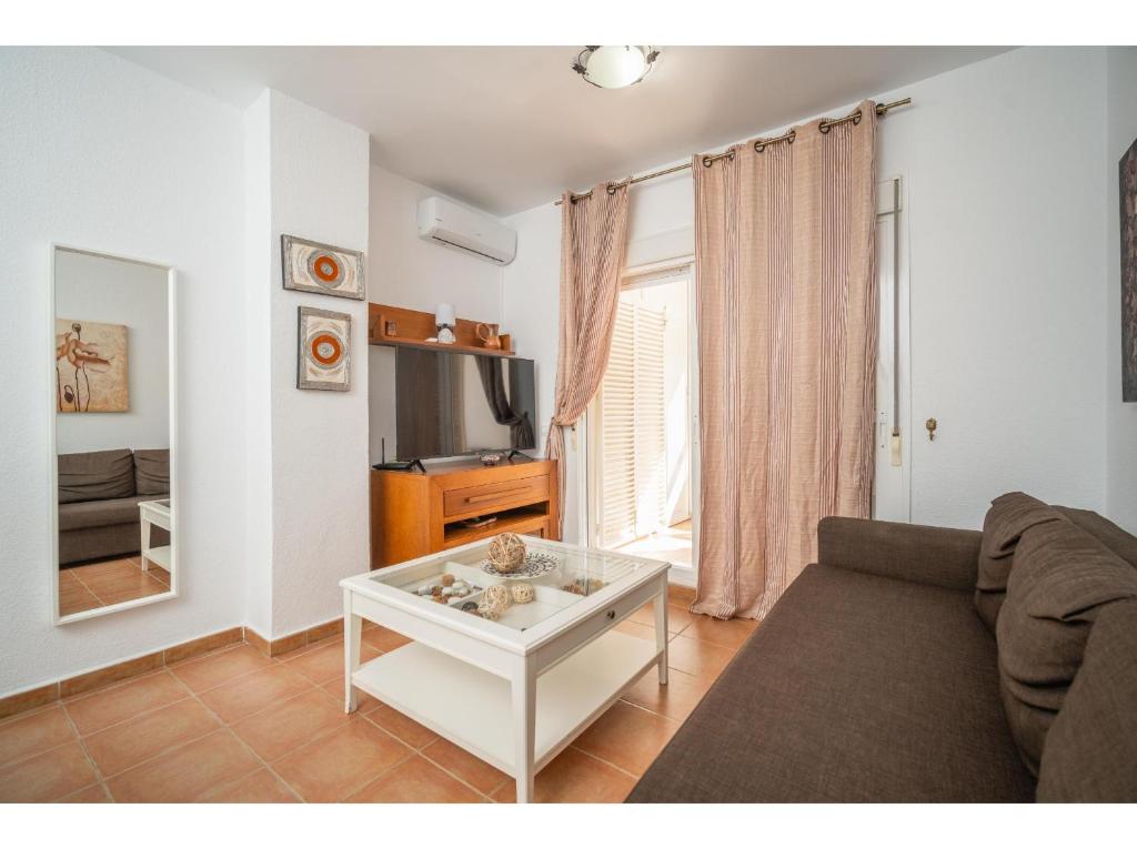 Telewizja i/lub zestaw kina domowego w obiekcie Apartamento 2H Zahara Mar