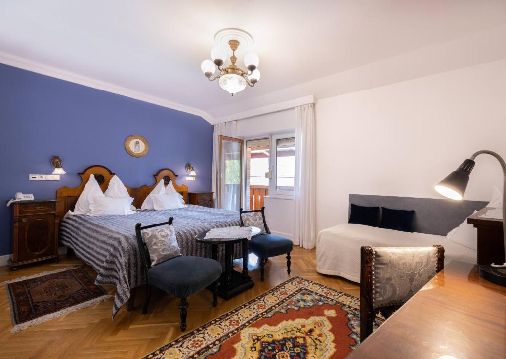 Postel nebo postele na pokoji v ubytování Boutique Hotel Szárcsa