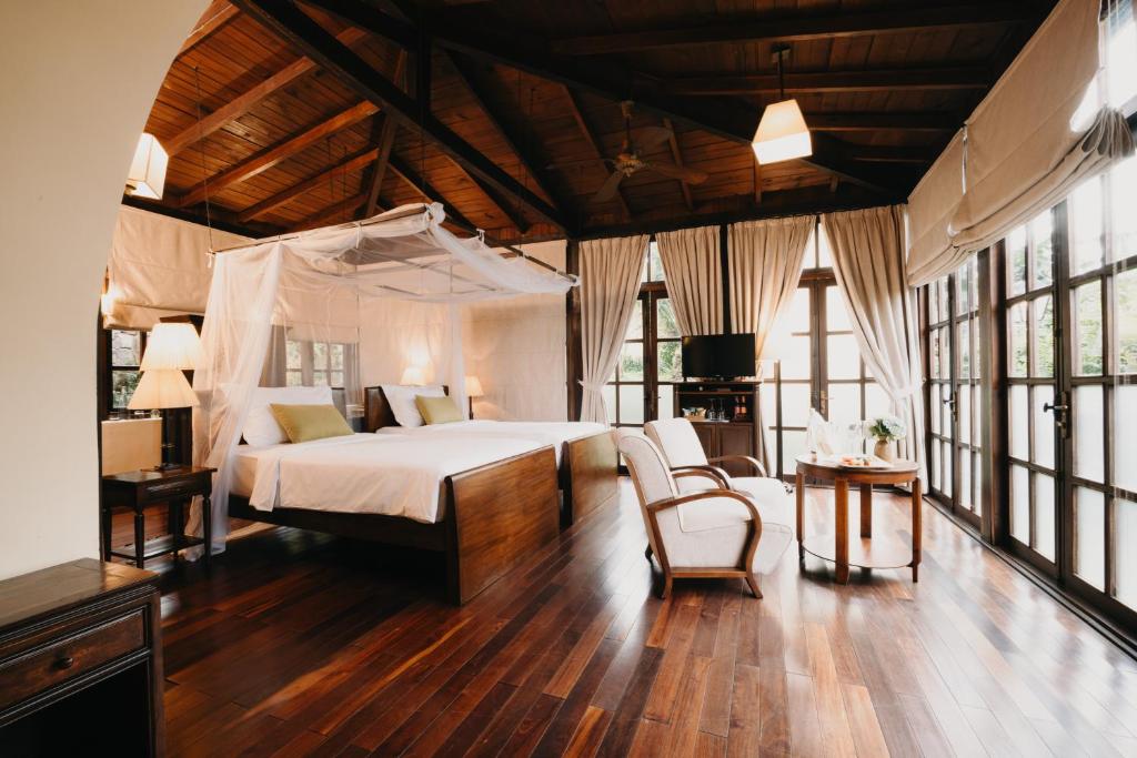 Postel nebo postele na pokoji v ubytování Ana Mandara Villas Dalat Resort & Spa