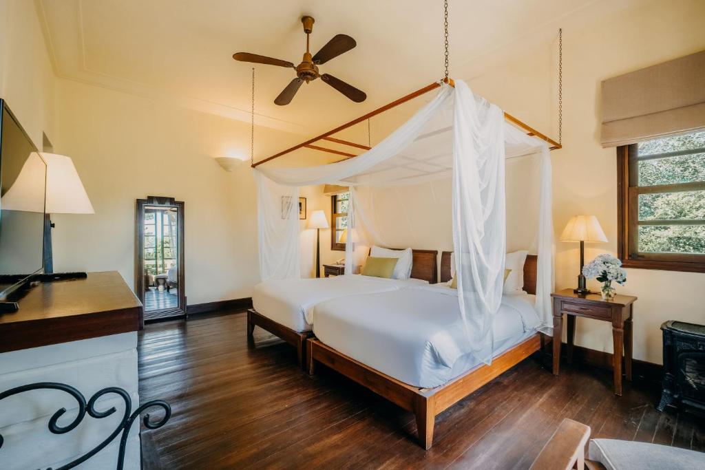 Postel nebo postele na pokoji v ubytování Ana Mandara Villas Dalat Resort & Spa