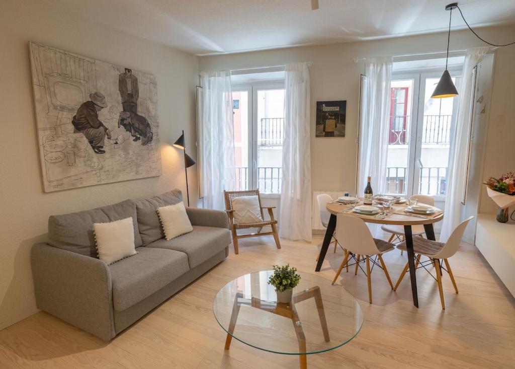 a living room with a couch and a table at Zapatería 30 by Clabao in Pamplona