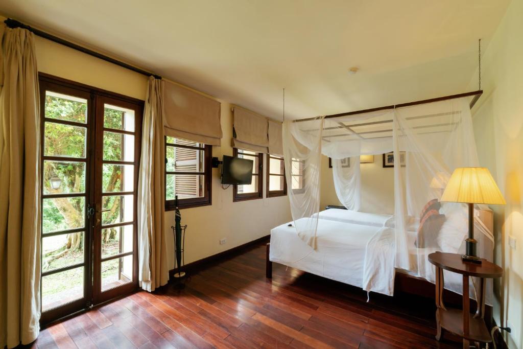 Postel nebo postele na pokoji v ubytování Ana Mandara Villas Dalat Resort & Spa
