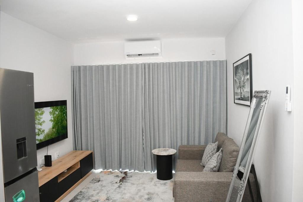 TV a/nebo společenská místnost v ubytování Sarona Kappa C107