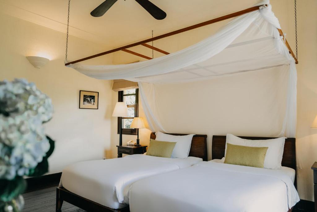 Giường trong phòng chung tại Ana Mandara Villas Dalat Resort & Spa