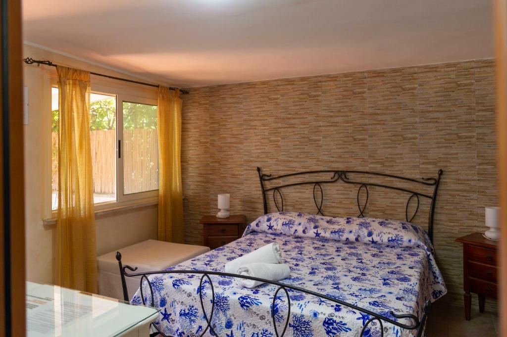 Postel nebo postele na pokoji v ubytování B&B Appartamenti l'Anfora