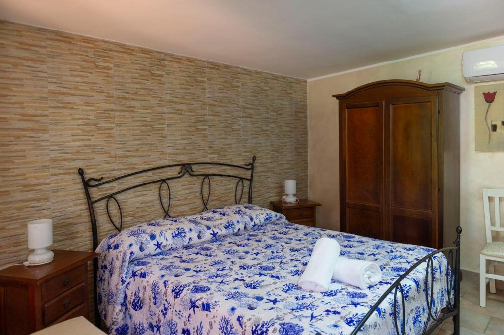 Postel nebo postele na pokoji v ubytování B&B Appartamenti l'Anfora