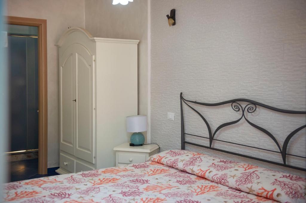 Postel nebo postele na pokoji v ubytování B&B Appartamenti l'Anfora