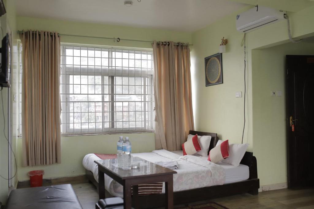 Postel nebo postele na pokoji v ubytování Hotel Arhant Inn