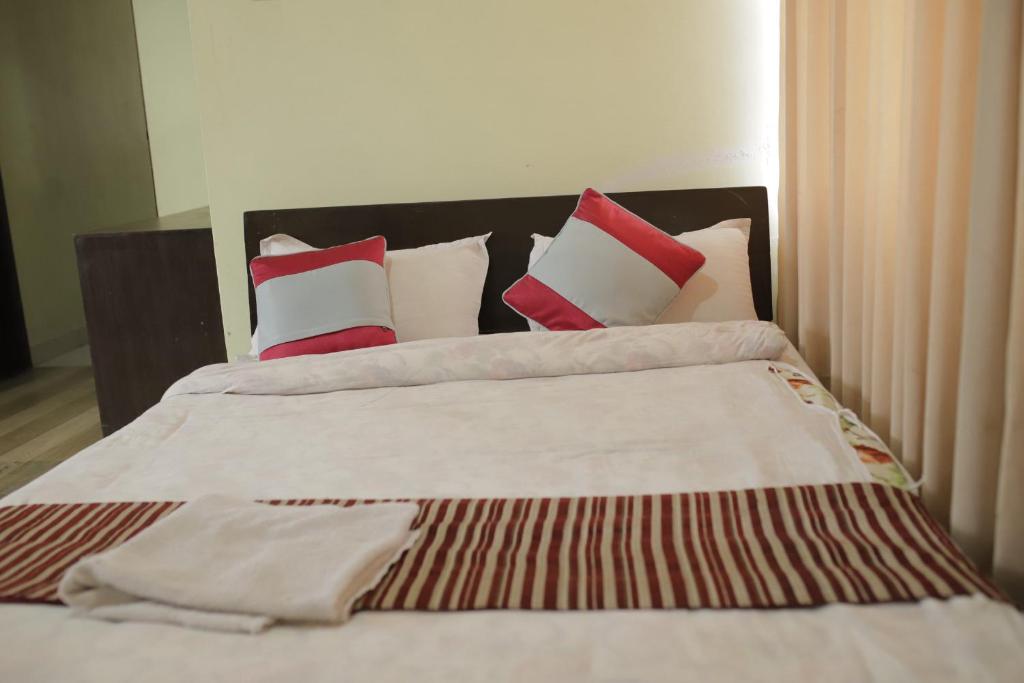 Postel nebo postele na pokoji v ubytování Hotel Arhant Inn