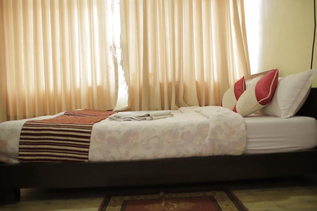 Postel nebo postele na pokoji v ubytování Hotel Arhant Inn