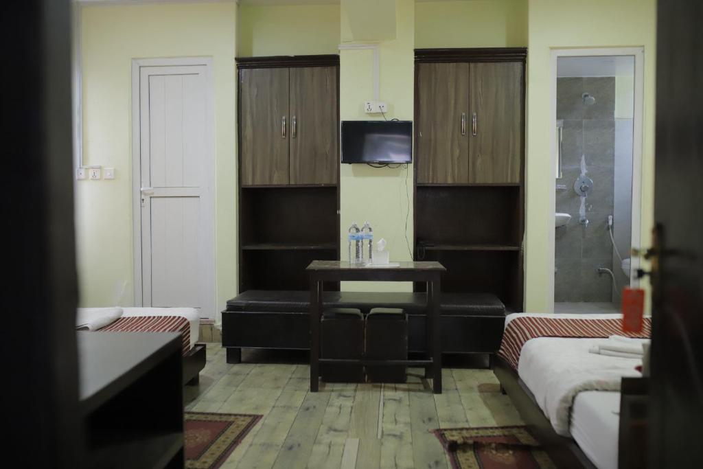 Postel nebo postele na pokoji v ubytování Hotel Arhant Inn