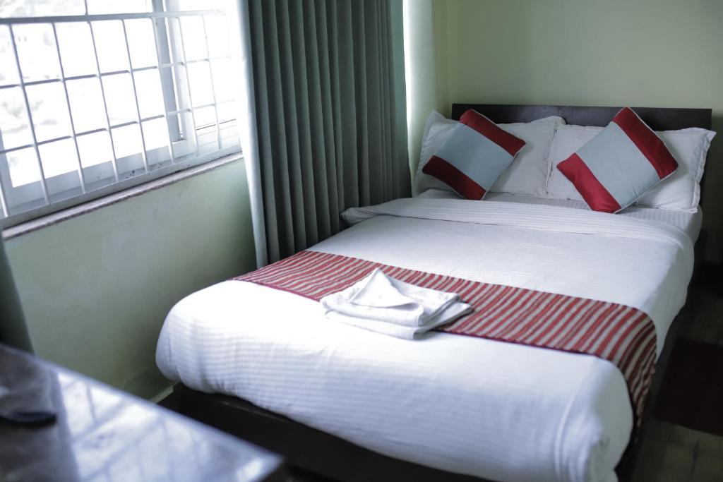 Postel nebo postele na pokoji v ubytování Hotel Arhant Inn