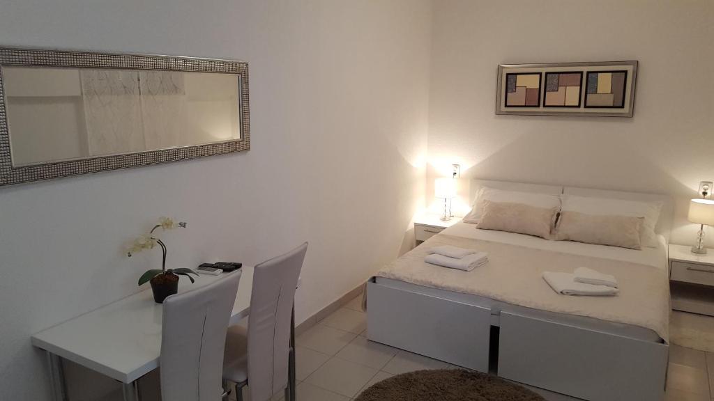 Postel nebo postele na pokoji v ubytování Rooms Valentino