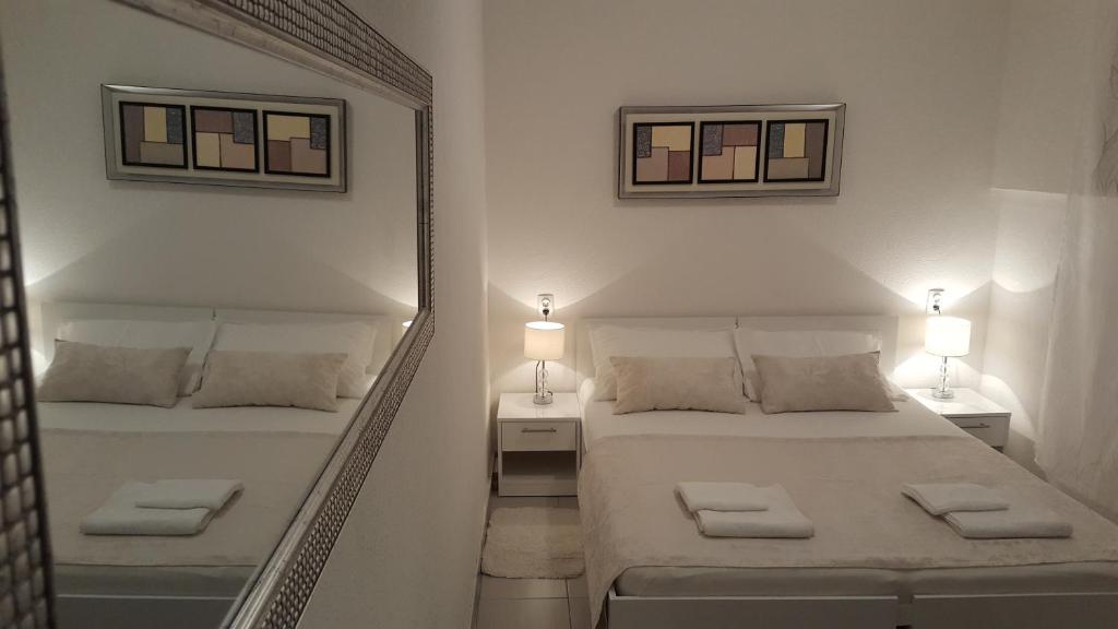 Postel nebo postele na pokoji v ubytování Rooms Valentino