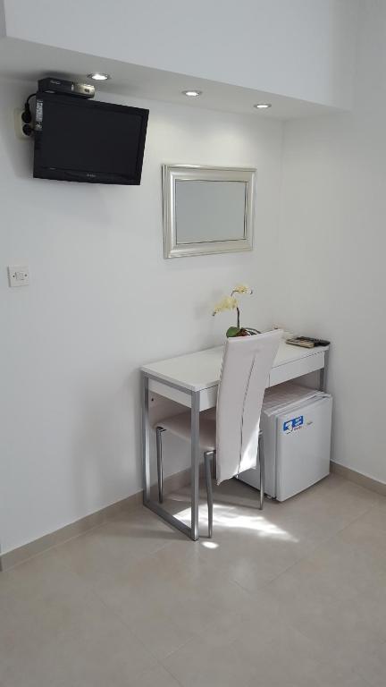 TV a/nebo společenská místnost v ubytování Rooms Valentino